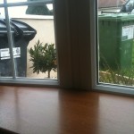 oak pvc sil with white window - WeFixWindowsandDoors.ie